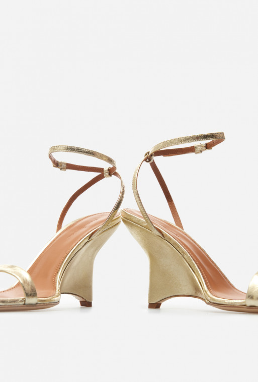 Isa gold leather
sandals