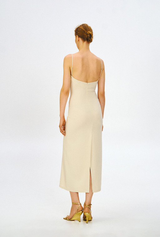 Dress with thin straps of milky color